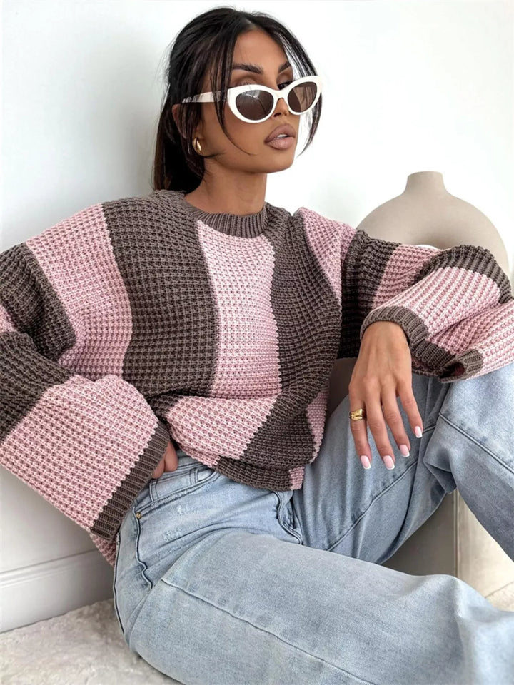 Pink and brown striped sweater, model leaning back with sunglasses