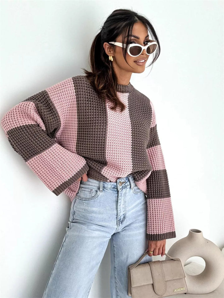 Pink brown color block sweater styled with jeans, sunglasses and a taupe bag