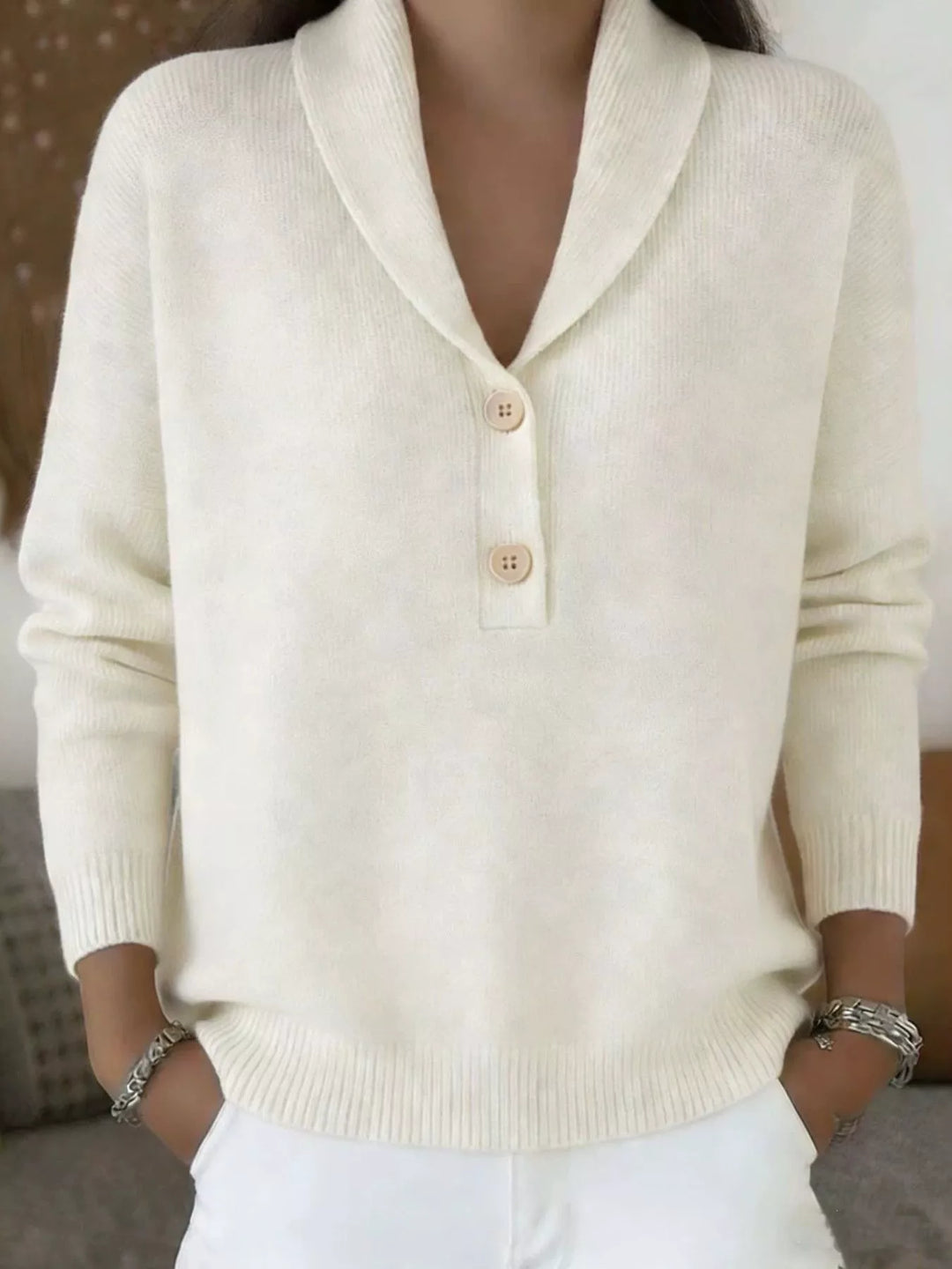 Cream relaxed V neck sweater with button placket, front view