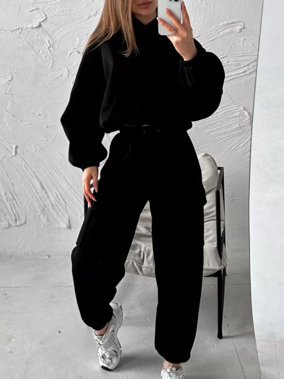 Black hoodie and cargo joggers set worn with white sneakers, mirror selfie