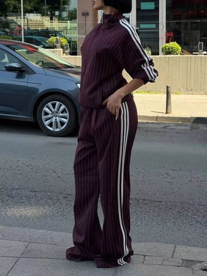 Burgundy pinstripe zip jacket and wide leg pants with white side stripes