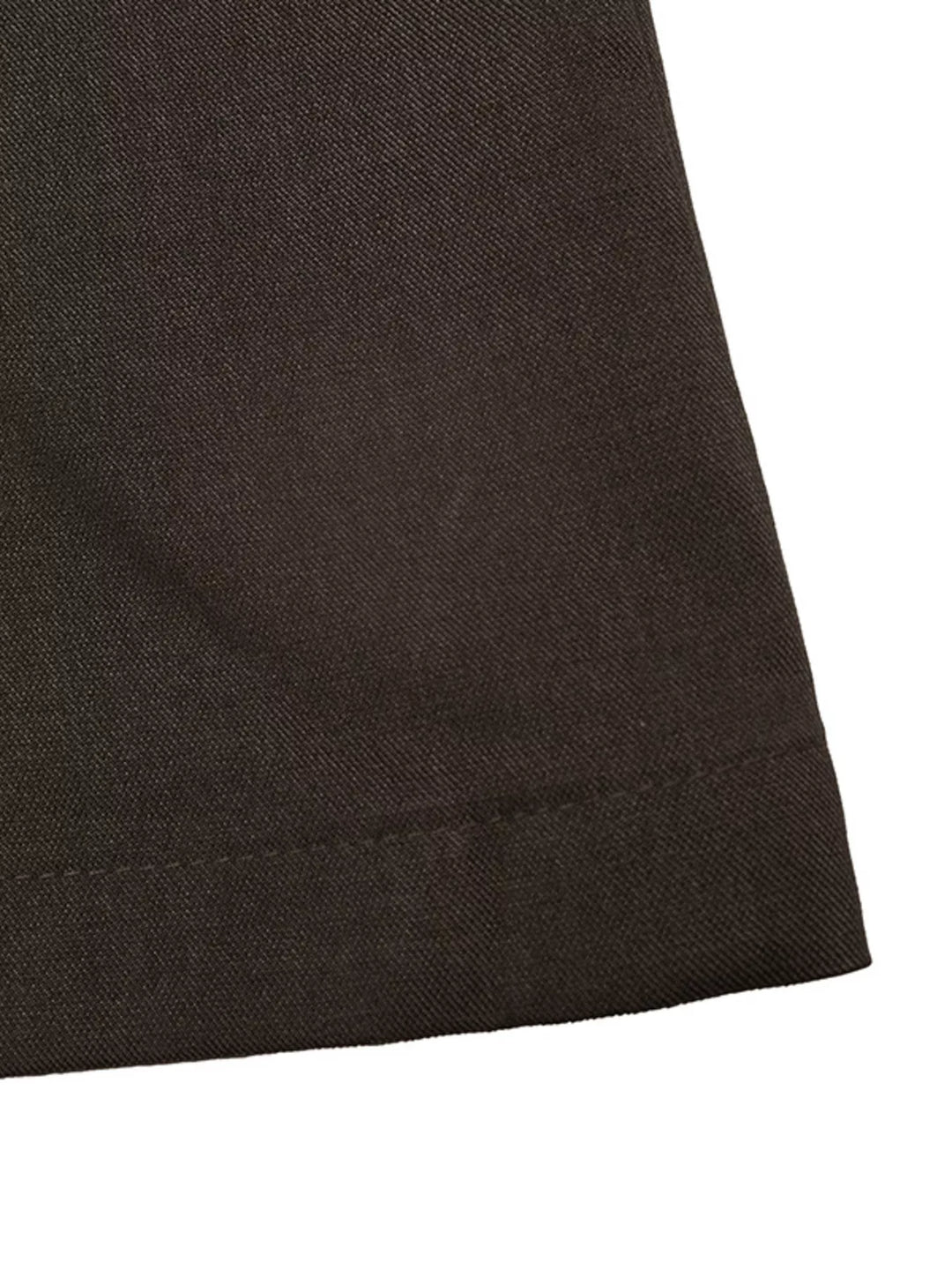 Close-up of the coffee brown trouser hem with clean stitching