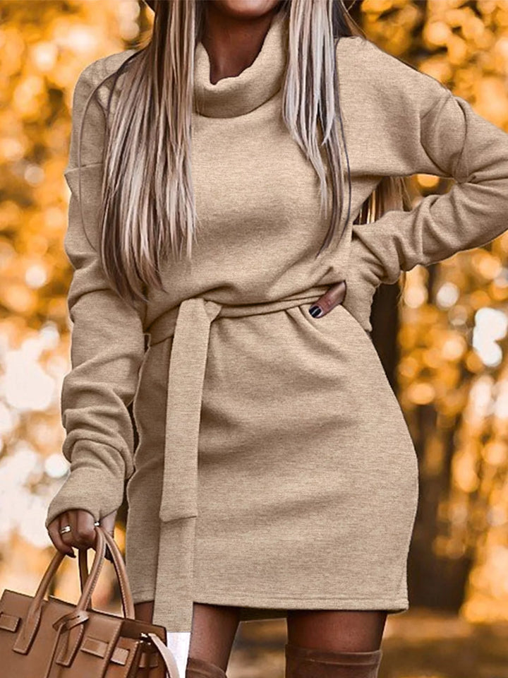 Khaki sweater dress worn on a model, showing the ribbed knit look