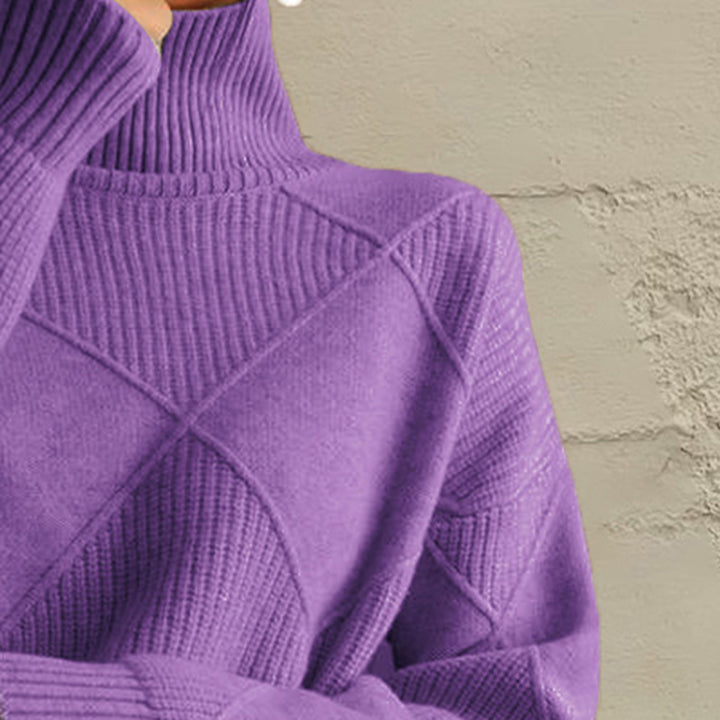 Close-up of the lavender geometric diamond knit sleeve and ribbed cuff