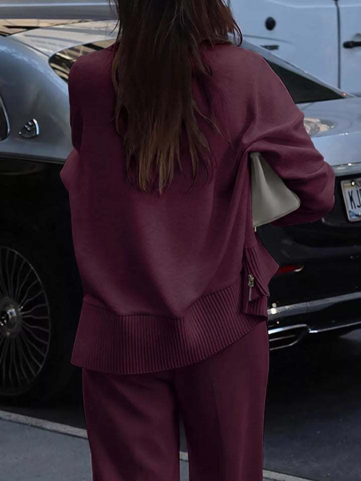 Back view of the burgundy mock neck pullover over matching wide leg pants