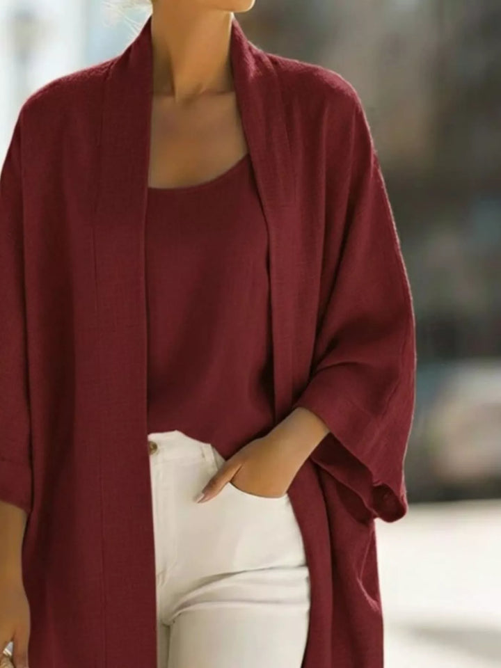 Close-up of the burgundy open front cardigan with wide sleeves and matching tank
