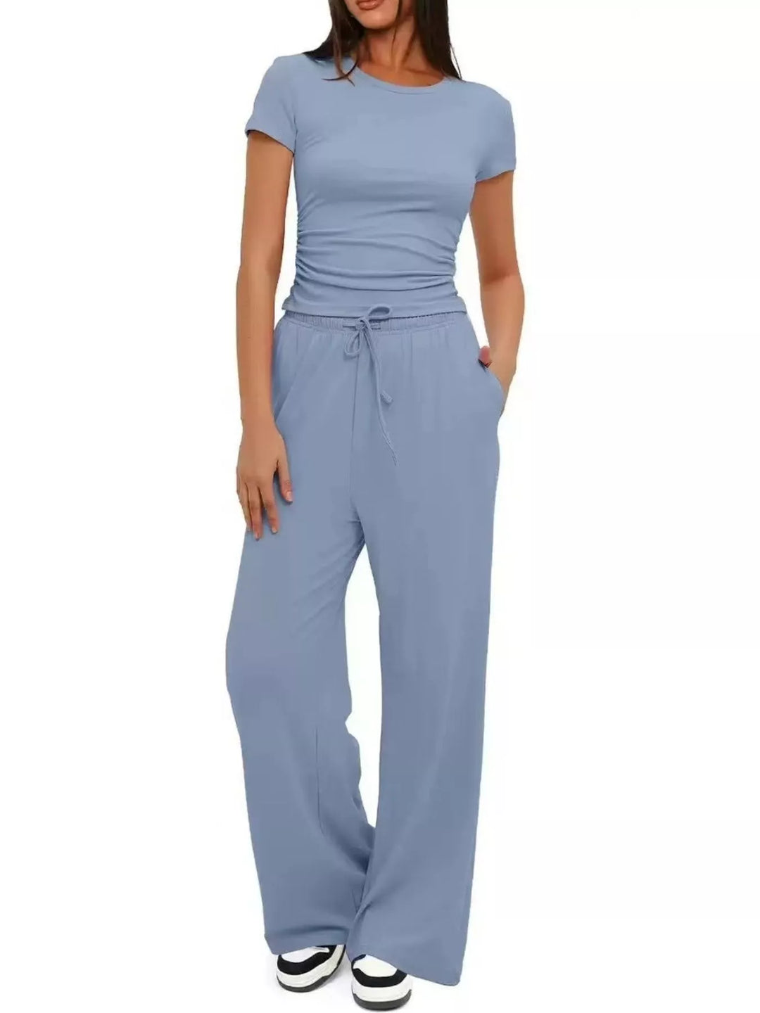 Light blue two piece set with ruched top and wide leg pants, front view