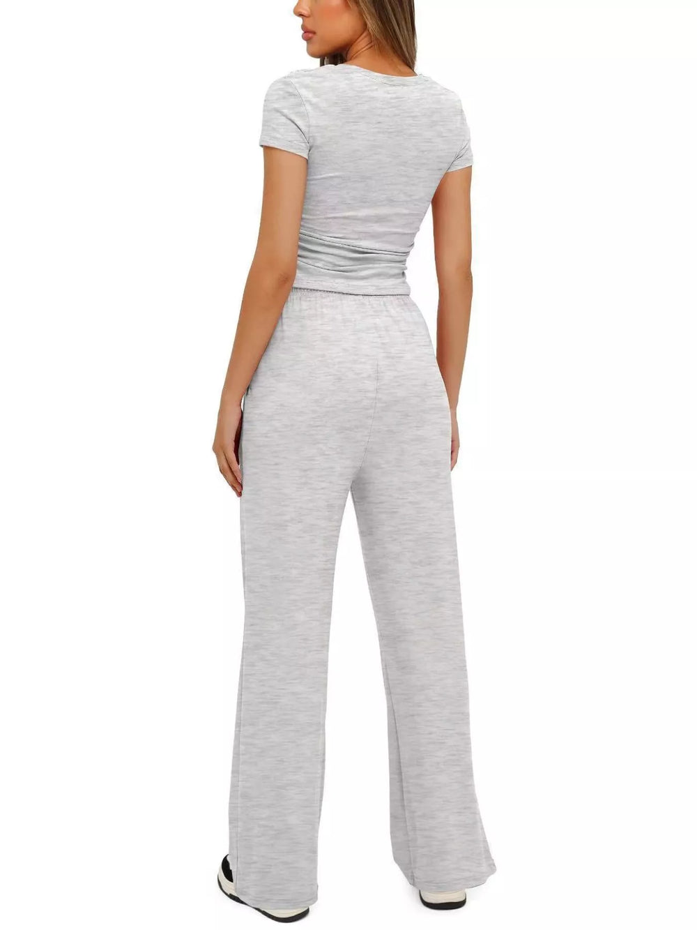 Back view of the light gray ruched top and wide leg pants set