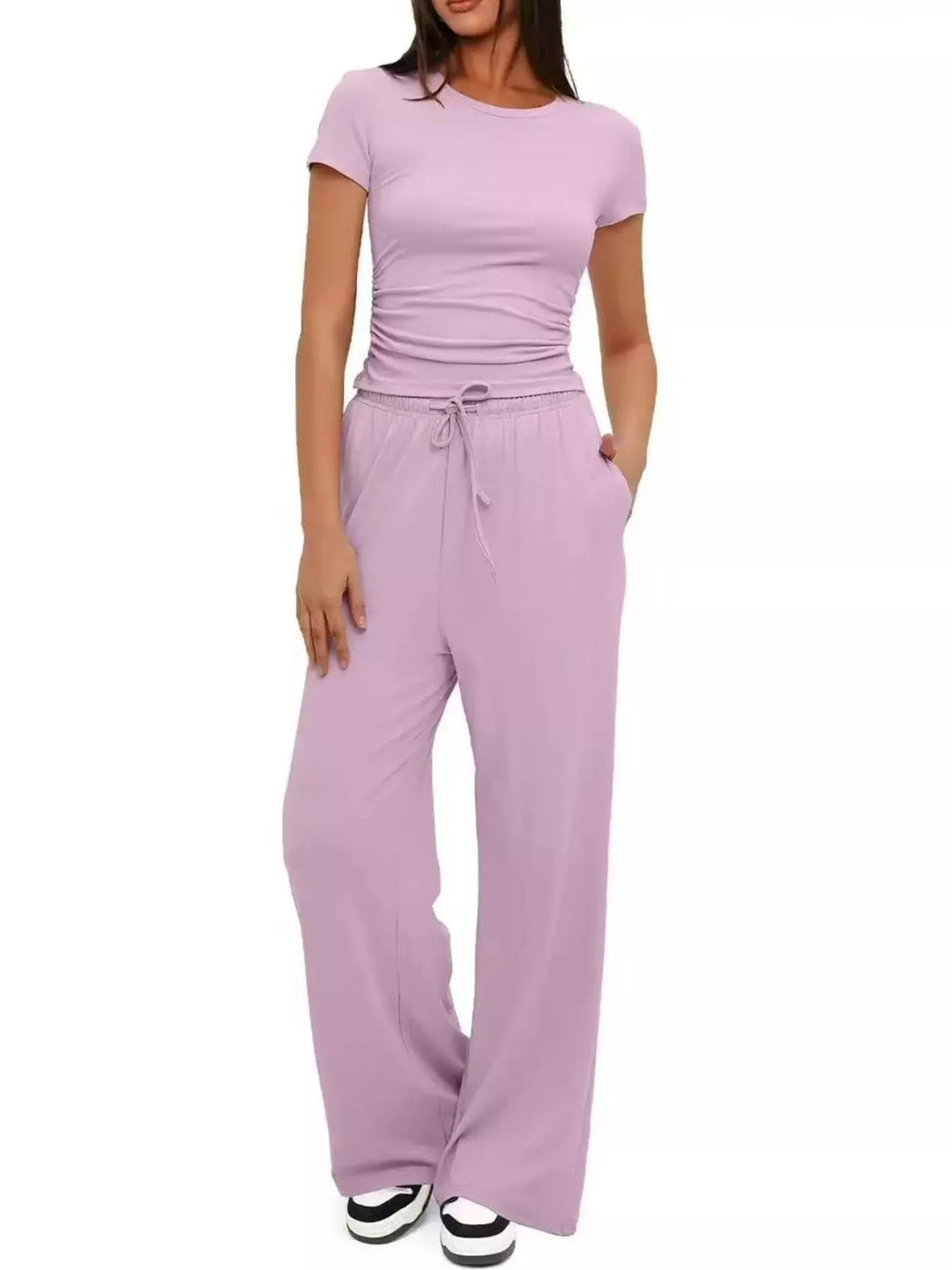 Lilac crop top and wide leg pants set with sneakers, front view