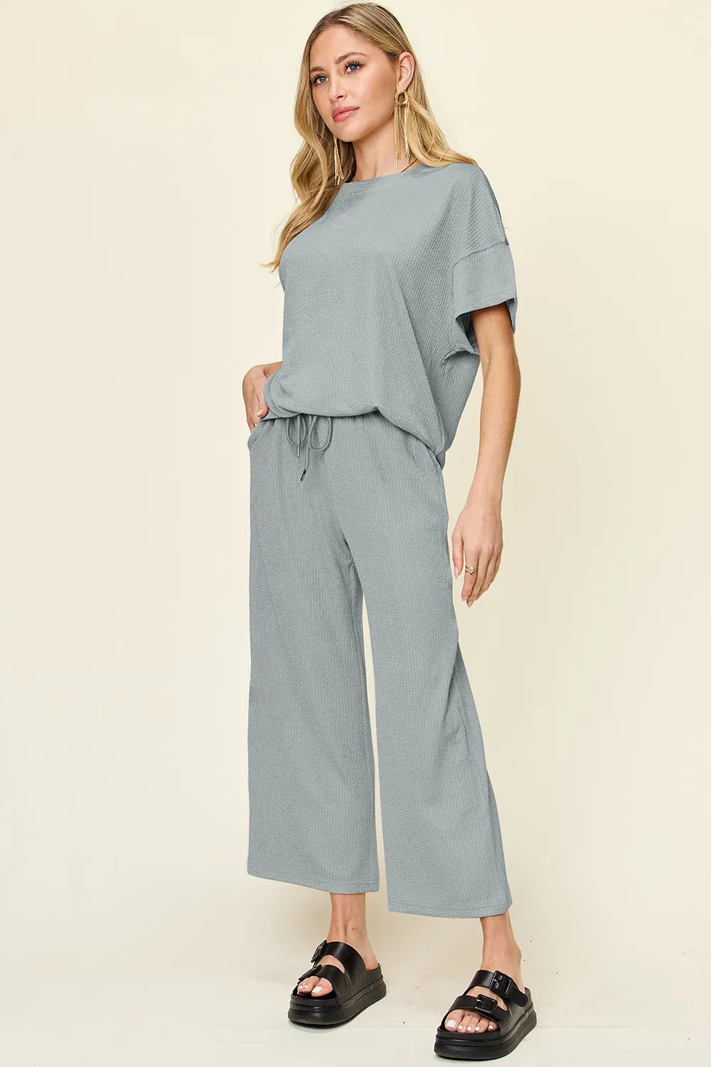 Dusty blue two piece set with short sleeve top and cropped pants