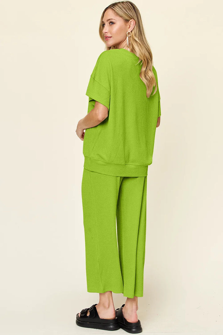 Back view of the lime green two piece set, side angle