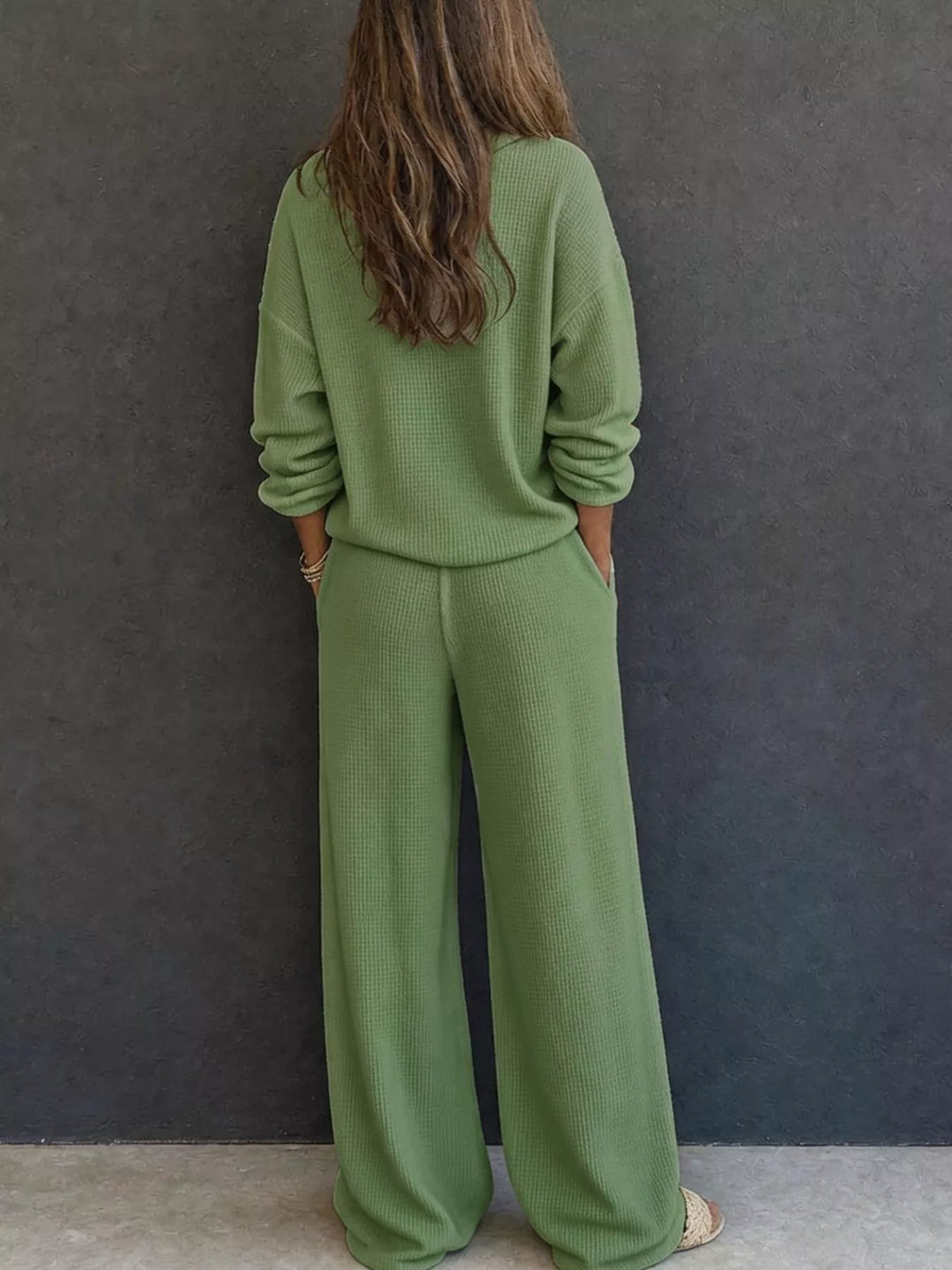 Back view of the matcha green waffle knit henley and wide leg pants set