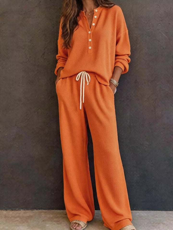 Orange two piece set with waffle knit henley and wide leg pants, full view