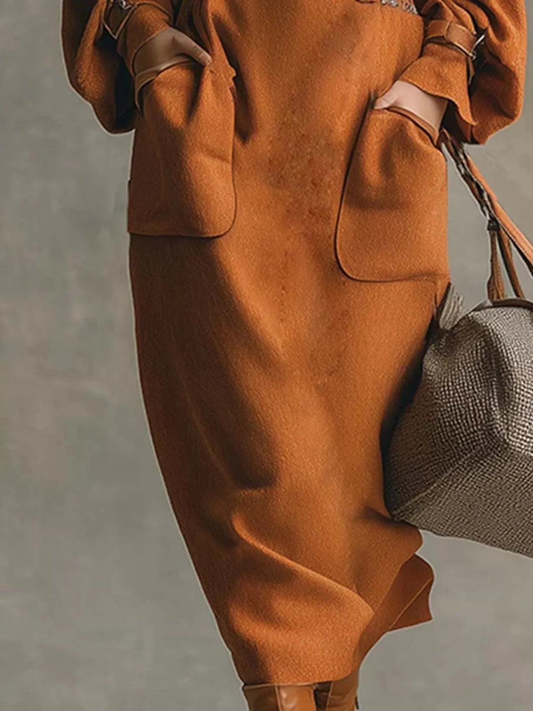 Rust midi skirt with large patch pockets, hand in pocket, carrying a handbag