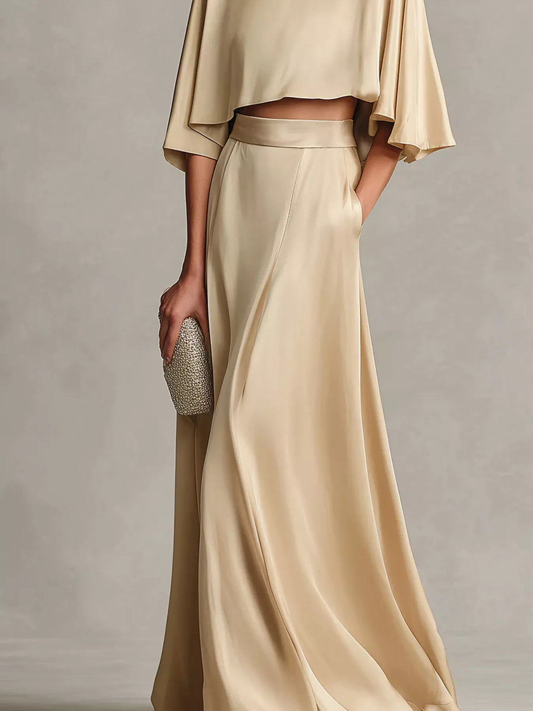 Lower body view of the champagne maxi skirt with the cropped top hem