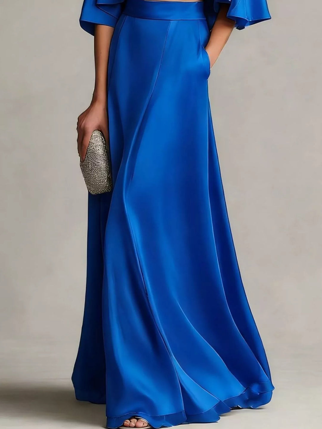 Lower view of the royal blue satin look maxi skirt with pocket detail