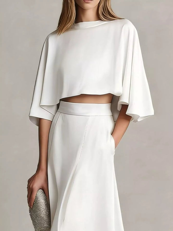 White two piece skirt set with a flutter sleeve crop top, front view