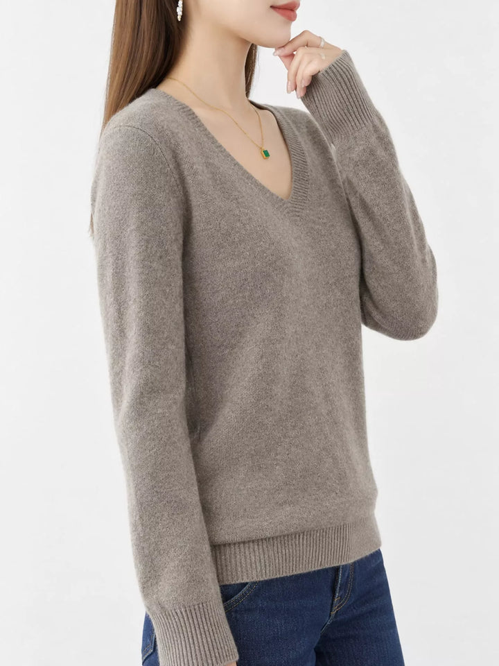 Dark Camel V neck sweater worn on-model, side angle with a relaxed fit