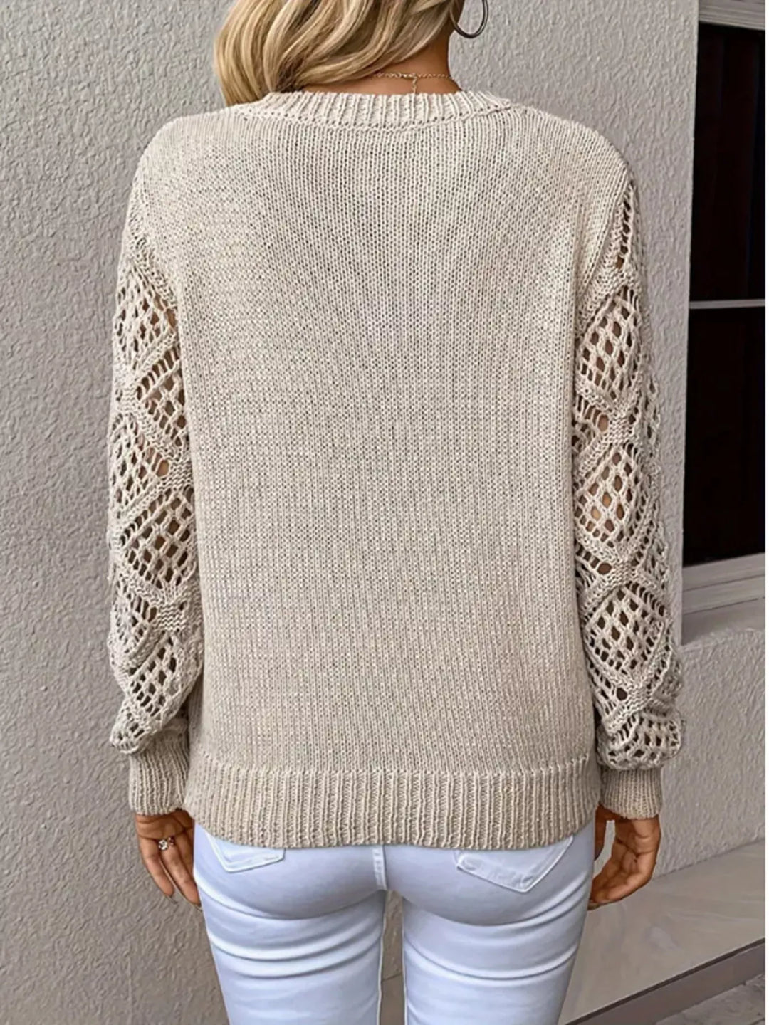 Back view of the oatmeal v neck sweater with diamond cutout sleeves
