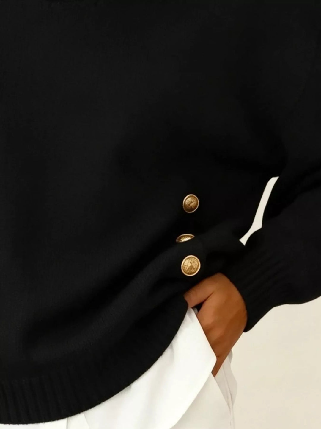 Polo collar gold-tone side buttons in black, close-up detail 2