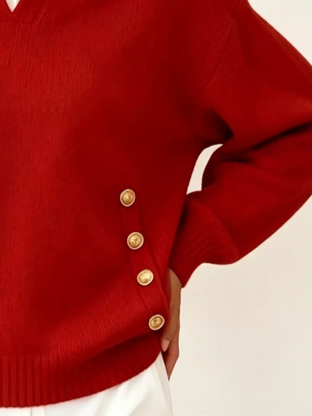 Polo collar gold-tone side buttons in red, close-up detail 2