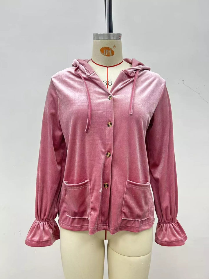 Dusty pink velvet jacket front view on a mannequin showing buttons and ruffled cuffs