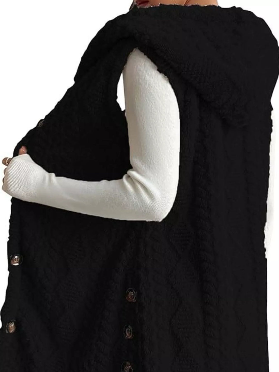 Black hooded vest from the side with the hood and side buttons visible