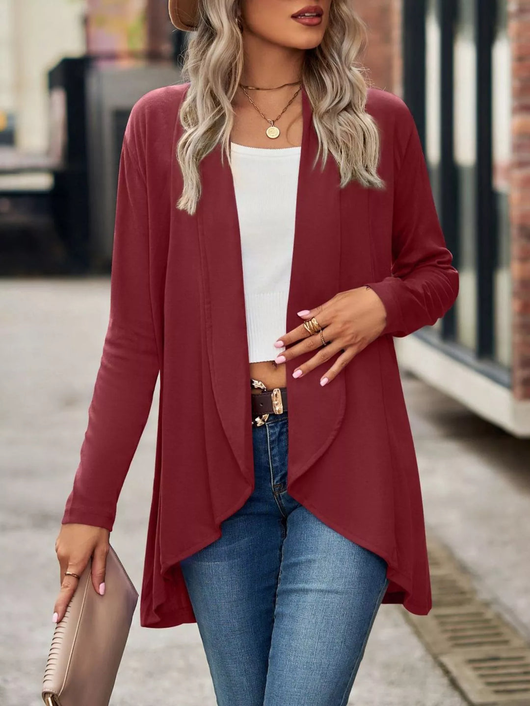 Burgundy open front long cardigan, front view with hand at the waist