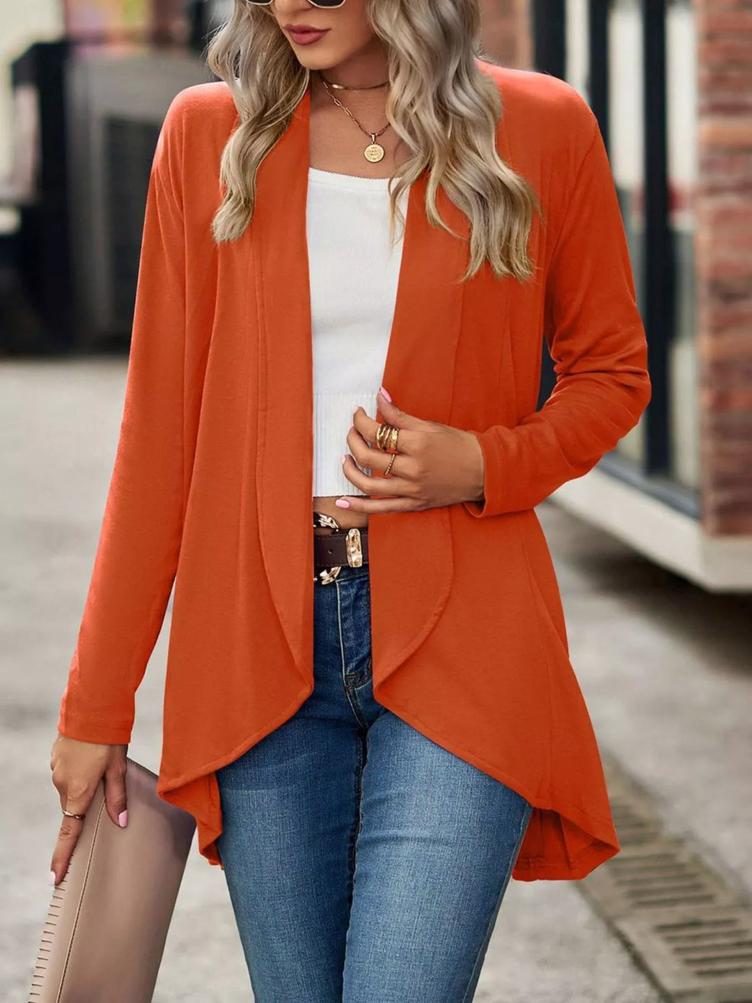 Burnt orange waterfall cardigan with open front, styled with white tank and jeans