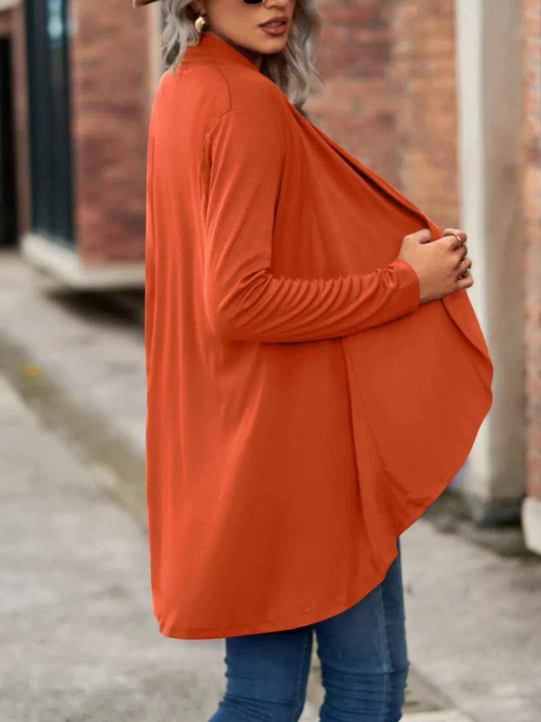 Side view of the burnt orange waterfall cardigan with soft drape