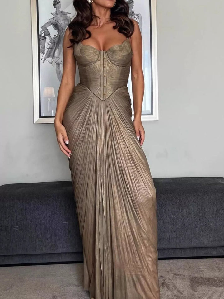 Gold maxi dress worn on a model, showing the fine pleats