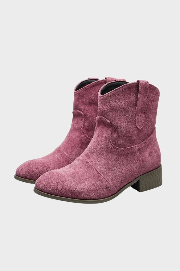 Women's pink western ankle boots with a low block heel