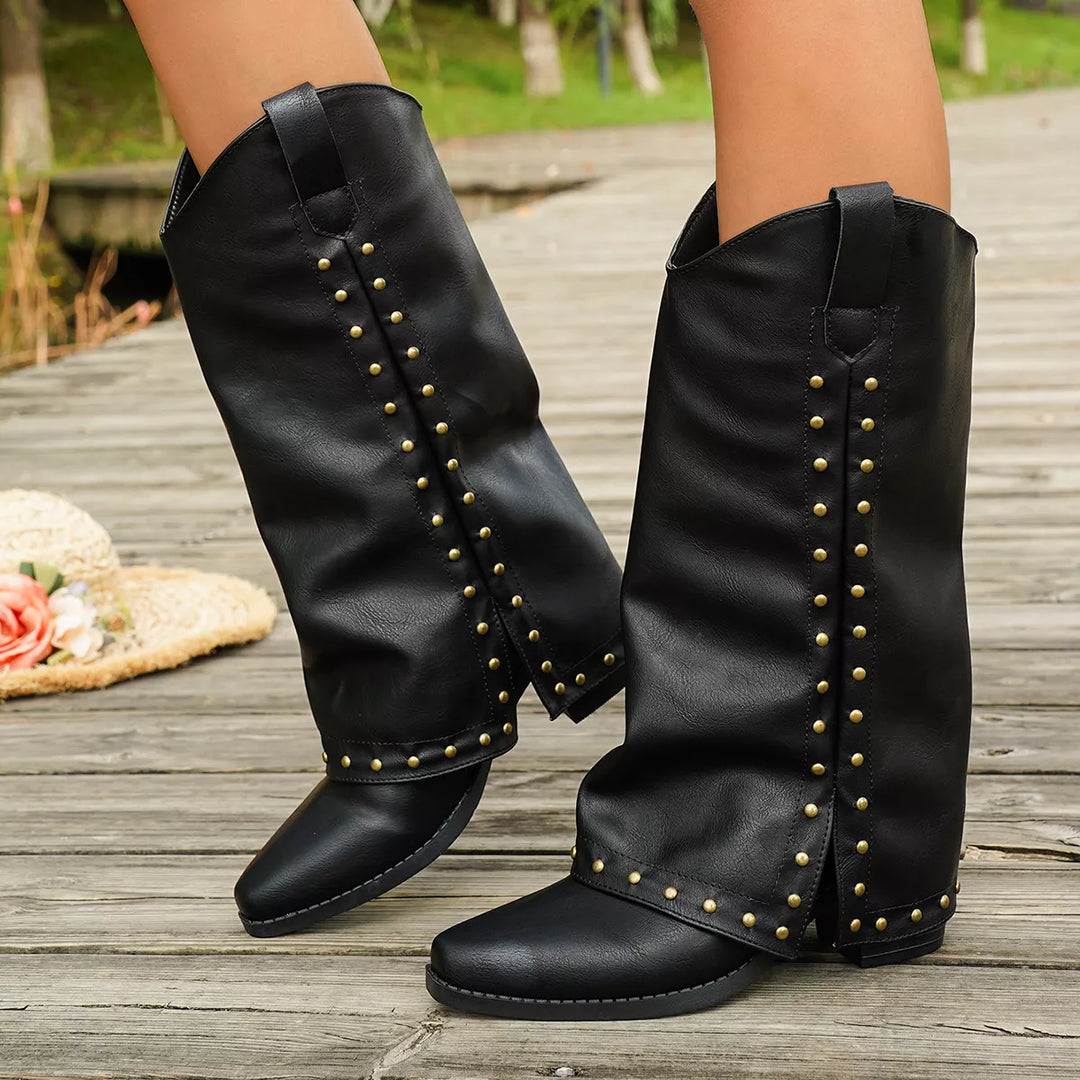 Black mid calf western boots with studded fold over shaft, side view