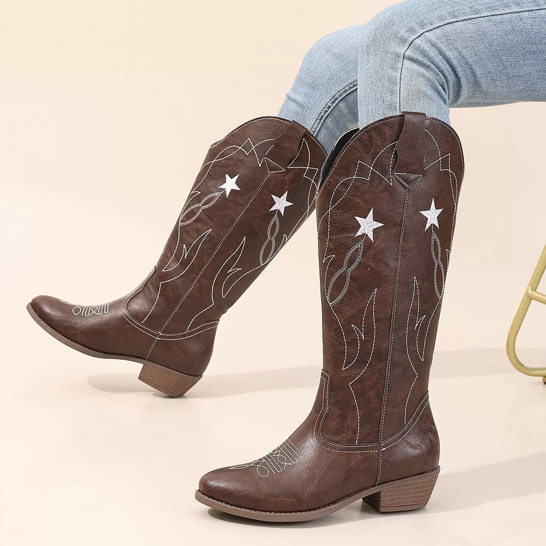 Chocolate brown western boots with star stitching, worn with light jeans