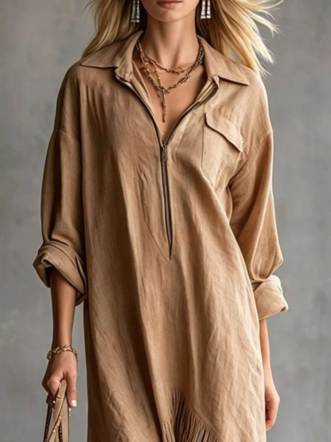 Camel shirt dress worn on a model, showing the pointed collar