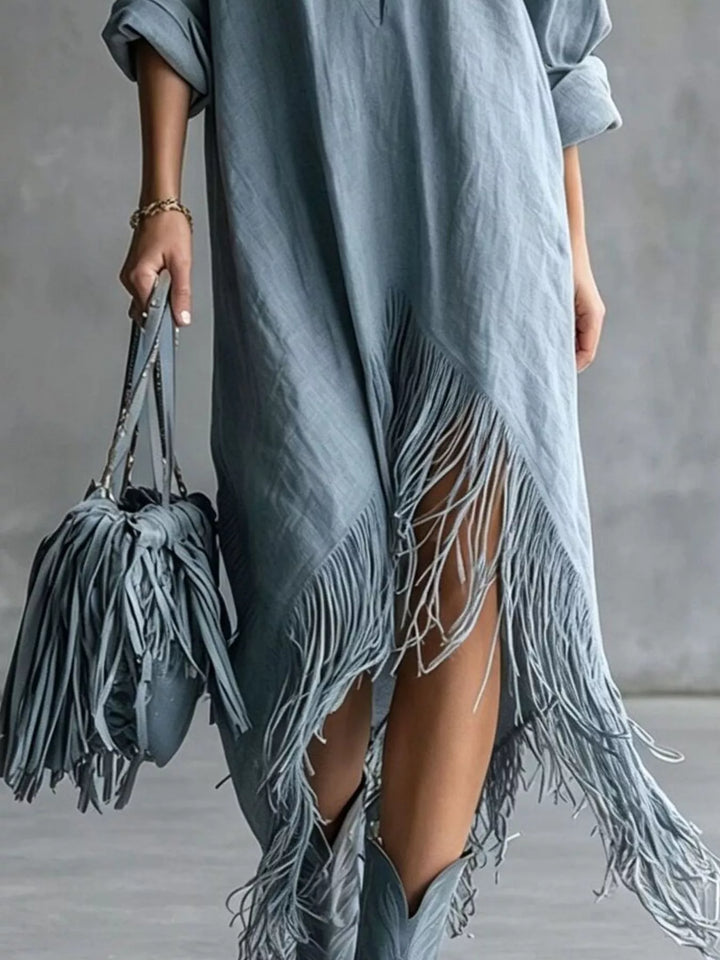 Dusty blue shirt dress worn on a model, showing the pointed collar
