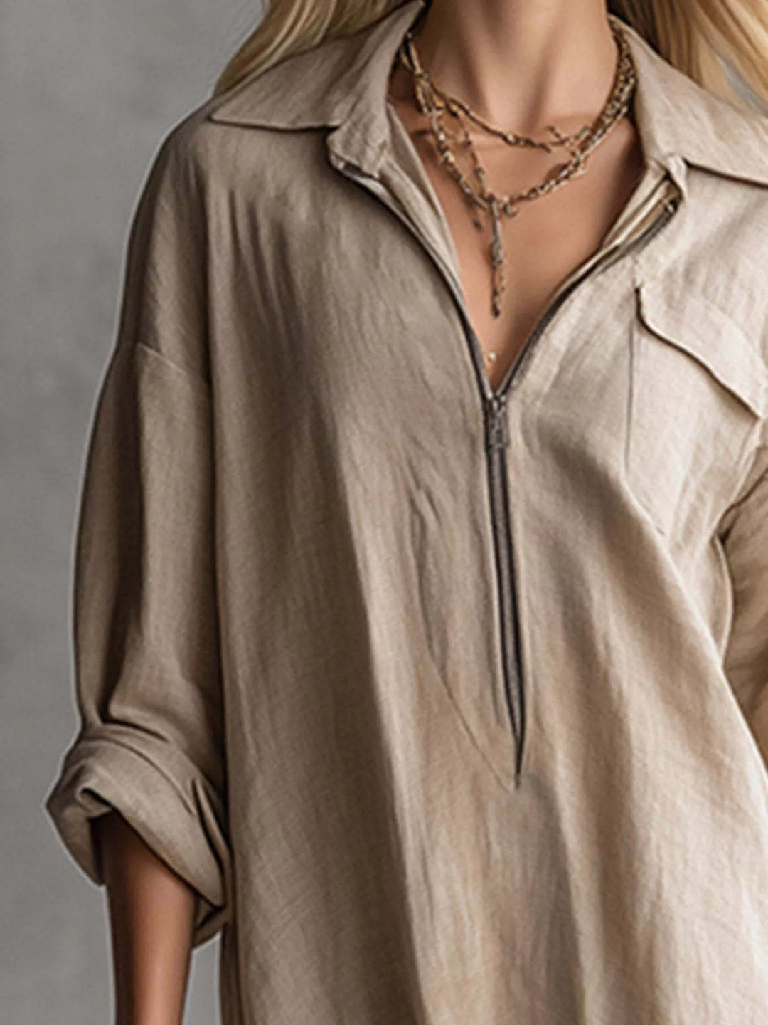 Khaki shirt dress worn on a model, showing the zip front