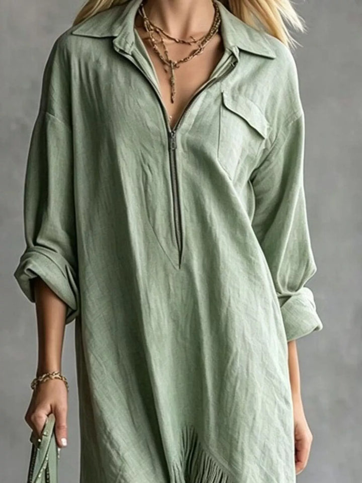 Sage shirt dress worn on a model, showing the pointed collar