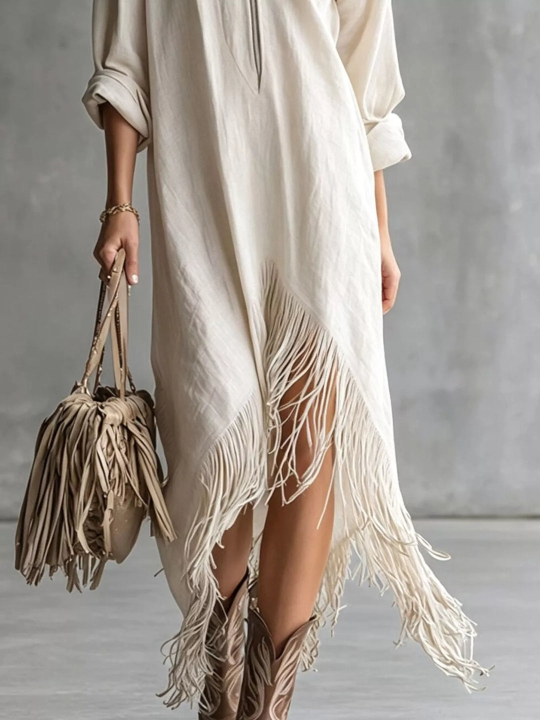 White shirt dress worn on a model, showing the pointed collar