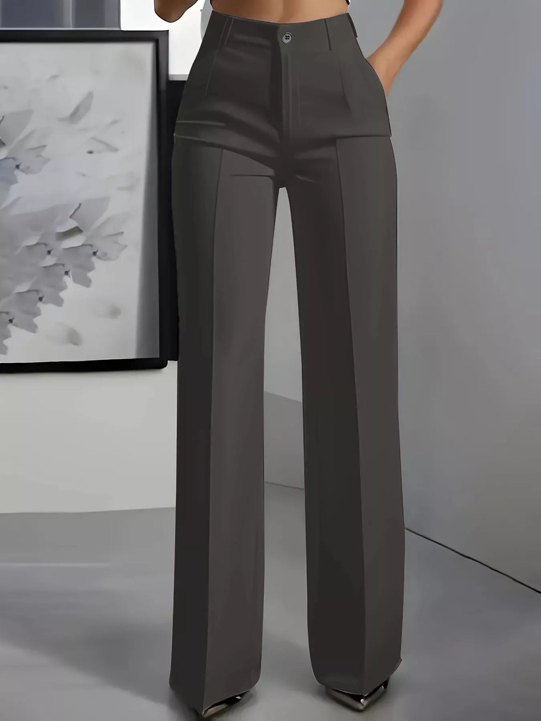 Charcoal high waisted wide leg dress pants with a pressed crease, front view
