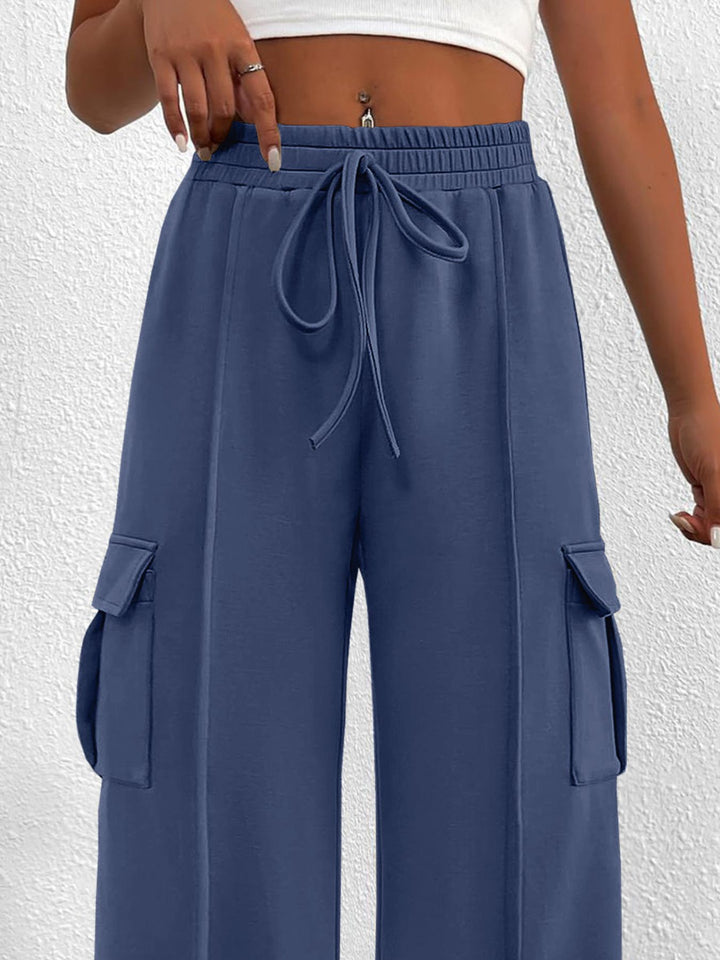 Close-up of the women's slate blue cargo pockets and drawstring waist