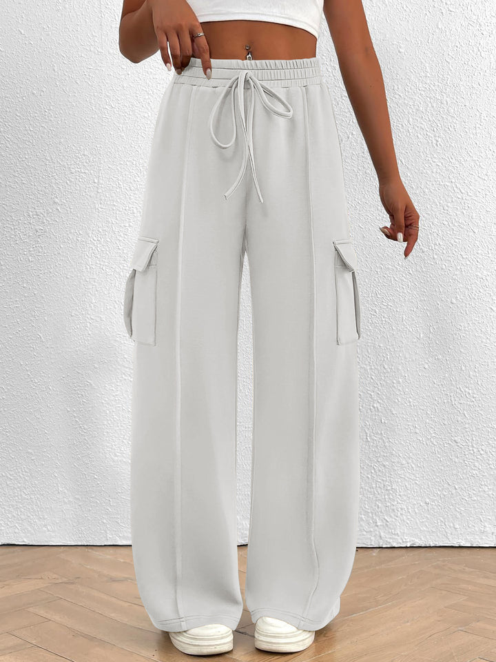 Women's white wide leg cargo pants with high waist and drawstring, front view