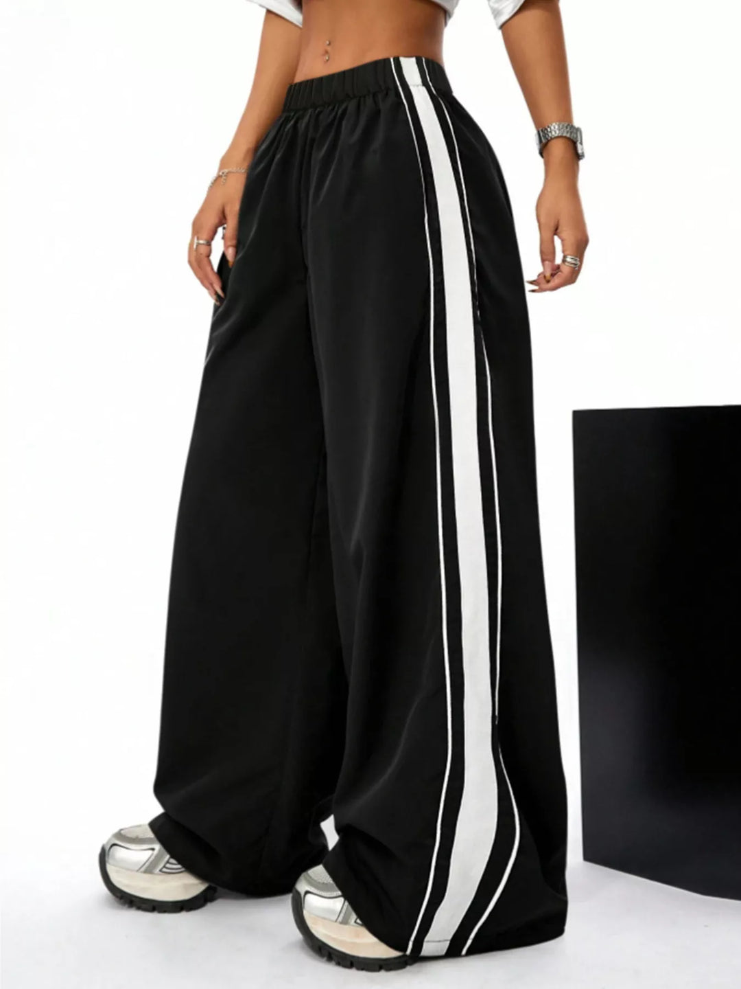 Women's wide leg pants in black, contrast side stripes elastic waist baggy