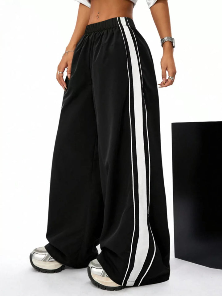 Women's wide leg pants in black, contrast side stripes elastic waist baggy