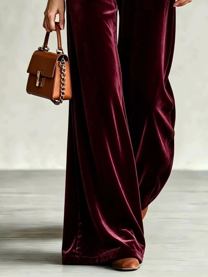 Lower view of the burgundy soft pile wide leg pants in motion