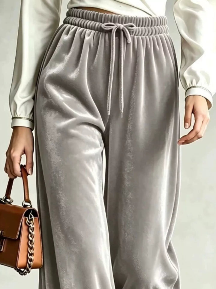 Close-up of the gray drawstring waist and soft pile wide legs