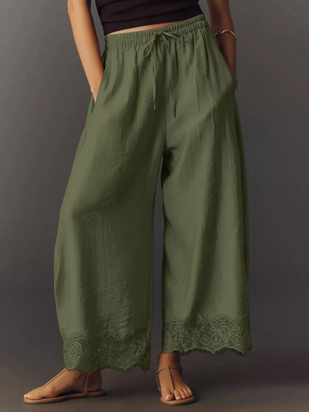 Army green wide leg pants front view with drawstring waist and lace hem