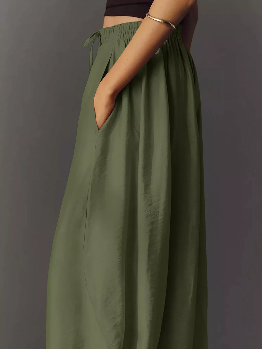 Side view of the army green wide leg pants with pocket