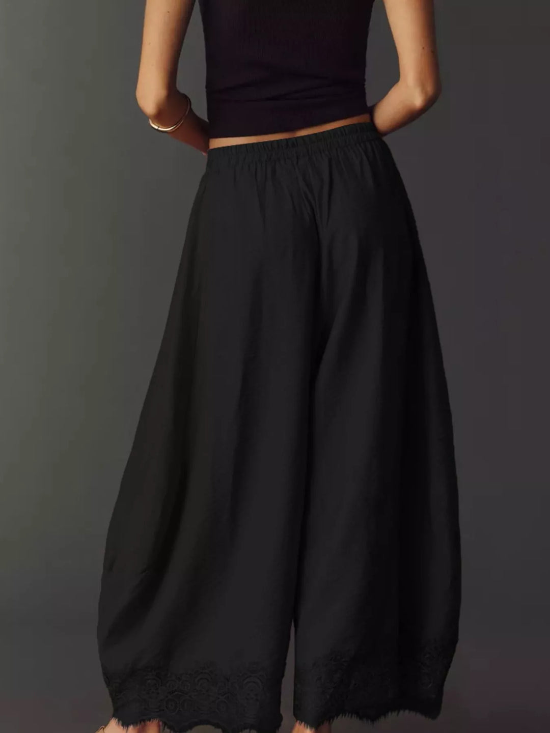 Black wide leg pants from behind with flowing legs