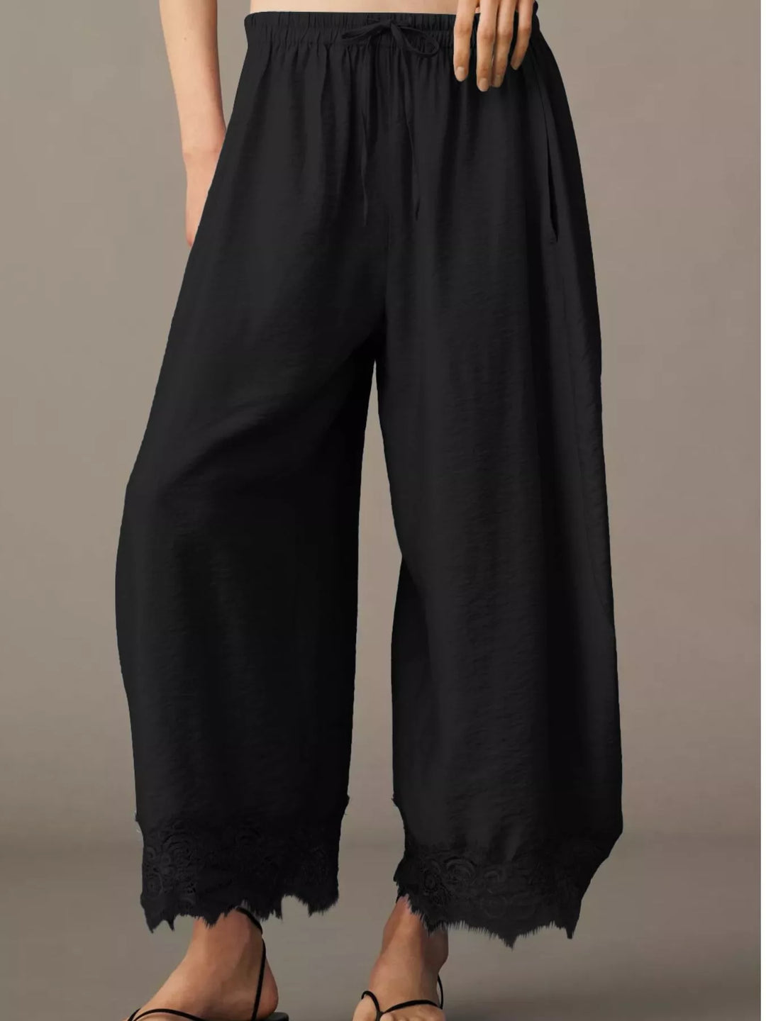 Back view of the black wide leg pants with elastic waist